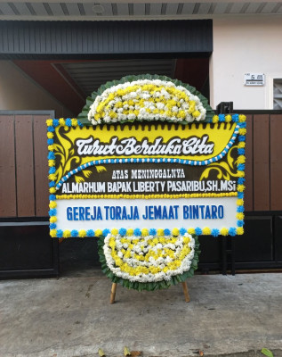 Papan Bunga Duka di Santiong